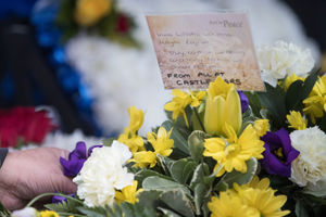 Flowers from taxi driver Imtiaz Mohammed's colleagues at Castle Cars in the hearse
