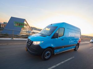 A blue PostNord van