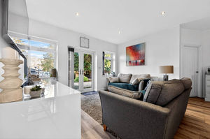 A south-facing garden with decking and pergola, ideal for relaxed outdoor evenings