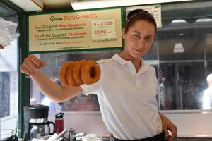 Kelly Gemmell shows off the freshly made and sugary ring doughnuts