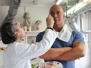 Supporting image for story: Paris museum remedies skin tone of Dwayne Johnson waxwork after his comments