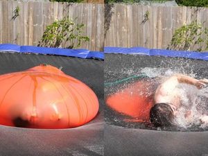 Supporting image for story: Here's a grown man bursting from a giant balloon filled with water in super slow motion