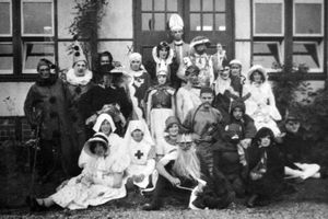 Handwritten on the back of this print is: 'Waxwork Carnival at Oswestry, 1930.' Back row, fourth from left marked with a cross is Emily Renshaw, as she will still have been known then. 