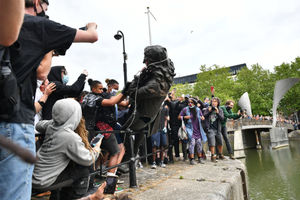 Protesters throw the statue of Edward Colston into Bristol harbour