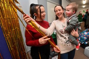 Neonatal worker Kaysey O'Toole with Jenni Bramfitt and Joel Bramfitt, aged 7 months