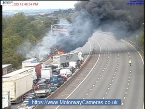 A picture taken near J13 for Stafford shows plumes of smoke coming from the lorry fire. Photo: Motorway Cameras