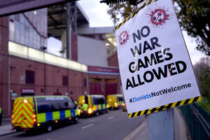 A poster that reads 'No war games allowed' is seen on a lamppost near the ground before the UEFA Europa League match at Villa Park, Birmingham. Photo: Joe Giddens/PA Wire