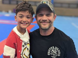 Supporting image for story: Star Tom Hardy makes young Wolverhampton fan's year with a hug after jiu-jitsu competition