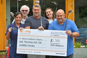 Jimmy Walker presents a cheque to Walsall's Acorns Hopsice after the charity golf day he hosted in May.  He is pictured with Matron Carmel Caldicot, Emma Rolinson and Alan Pithers..