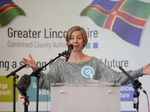 Dame Andrea Jenkyns speaking behind a podium