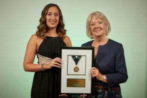 Optical director Jasmine Shoker with Dame Mary Perkins receiving the medal for Customer Service Excellence