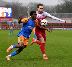 Shrewsbury Town’s Kevin Berkoe battles with Accrington Stanley’s Alex Henderson