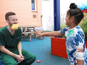 Supporting image for story: NHS doctor gets a soaking by young patients on Wolverhampton children's ward fun day