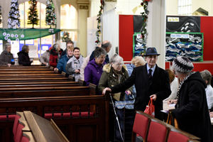 Pensioners queue at St Leonards Church, Bilston, to collect their £5 Christmas vouchers