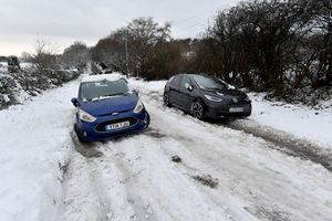 The scene around Aldridge after heavy snowfall.Two abandoned cars along Bridle Lane.