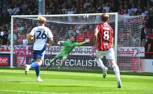 Evan Weir opens the scoring for Walsall with an excellent free-kick in the eighth minute.