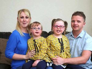 Supporting image for story: Twin helps sister to walk, talk and play