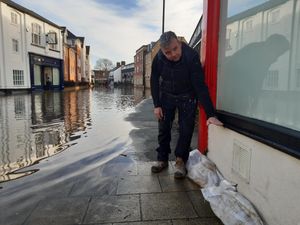Lee McGowan shows where the floods of 2000 reached in comparison to Thursday's peak in Longden Coleham