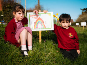 Supporting image for story: Kids make 'go slow' signs to stop motorists speeding through village 'before someone gets killed'