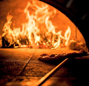 The pizzas are part-baked in wood-fired ovens