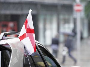 Supporting image for story: Flags attached to cars are not allowed to obstruct the driver’s vision