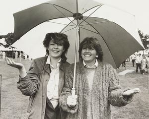 Tara Cain and her mother, Wendy, under an umbrella in Dudley. Undated. 