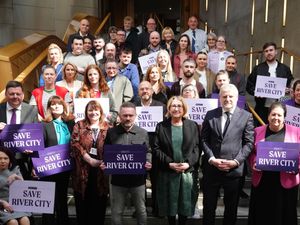 Cast and crew of River City with MSPs on the steps at Holyrood