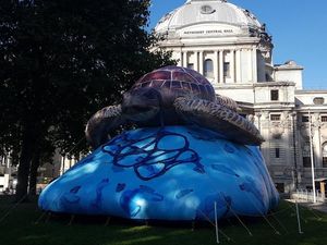 Supporting image for story: Giant inflatable turtle on display outside Parliament for climate strike