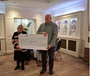 Lead Team President Carole Holdcroft presenting the cheque to Gary Fear 