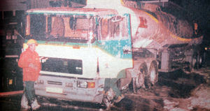 The stricken petrol tanker covered in foam.