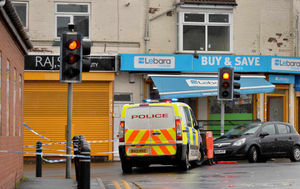 The search appeared to focus on R.J News at the junction of Tat Bank Road and Rood End Road