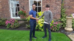 Adams Grammar students Tiondre Brown, left, and Morgan Phelps, right, celebrate securing their places at Imperial College, London having each achieved two A*s and one A