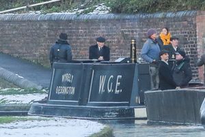 Cillian Murphy as Tommy Shelby during filming of the new Peaky Blinders film in Dudley, aboard a narrowboat with Wyrley spelled wrongly