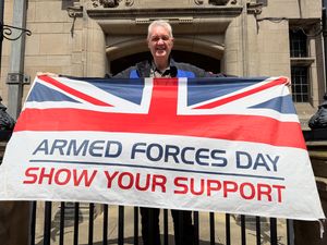 Vice-Chairman of Staffordshire County Council Gordon Munro with the Armed Forces flag