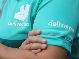 A person wearing a Deliveroo outfit