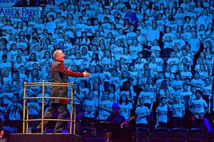 Conductor David Lawrence leading the young voices during the rehearsal