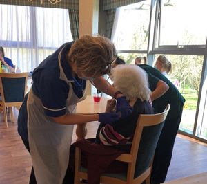 A resident receiving the vaccine