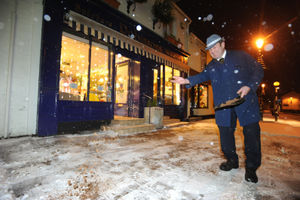 Stephen Robinson from Robinson's Butchers, puts salt down in Tettenhall
