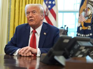 Supporting image for story: Wall Street falls as Trump imposes tariffs, but not as badly as feared