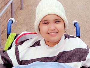 Supporting image for story: Talented teenager wins Christmas card competition after painting design with only her mouth