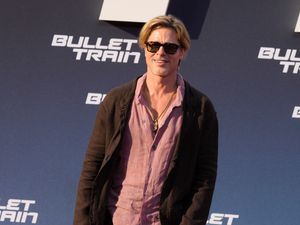 Supporting image for story: Brad Pitt swaps trousers for a skirt at Berlin red carpet event
