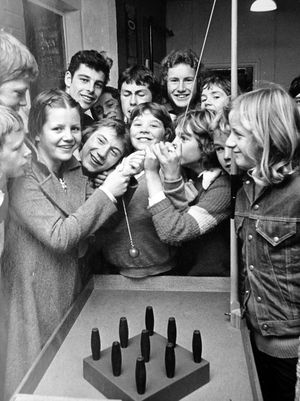 Ludlow Youth Club, October 1975. The caption reads: 'Susan Adams (16), of Hamlet Road, Ludlow, looks all set to show the boys a thing or two about table skittles at the new youth club at Galdeford, Ludlow.' 