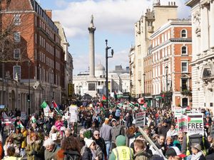 People take part in a pro-Palestine march in central London