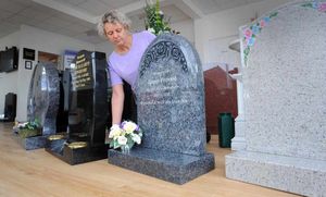 Andrea Harvey-Hall, masonry co-ordinator at the Co-Operative Memorials in Walsall, with traditional headstones in the showroom
