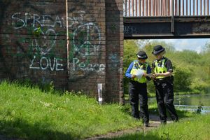 Officers at the canal near where the baby boy was found in May