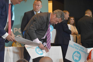 Nigel Farage signing posters during the rally