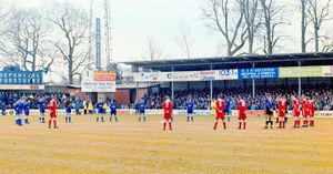 The Shrewsbury and Liverpool teams stand for a minutes silence before the FA Cup match today (Sunday) in respect of the former Liverpool manager Bob Paisley who died last week (PA)