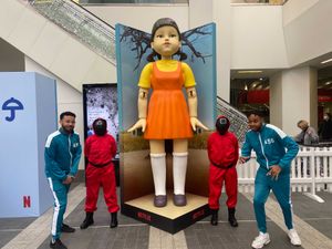 Supporting image for story: Squid Game doll keeps eyes on travellers at Birmingham New Street