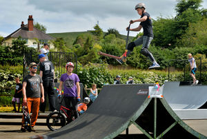 Tom Rochester in Church Stretton and Frank Popovic watches on as: Macauley Williams 13, flys through the air