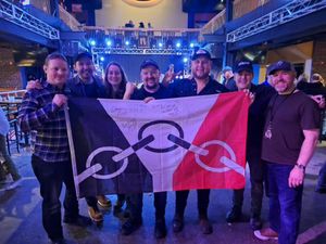 Ruth and Chris Smith-Moorhouse with their Black Country flag and members of Luke Combs UK